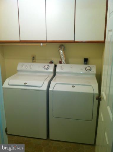 7709 Tower Woods Drive Springfield, VA 22153 - Photo 14 of 15 a utility room with dryer and washer