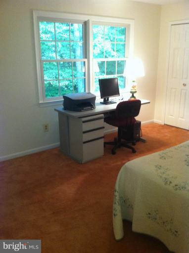 7709 Tower Woods Drive Springfield, VA 22153 - Photo 15 of 15 a view of a workspace with furniture and a window