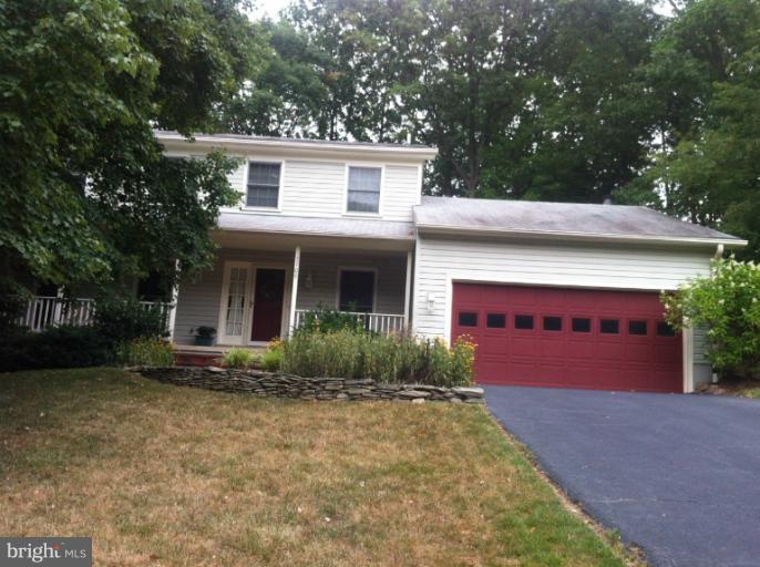 7709 Tower Woods Drive Springfield, VA 22153 - Photo 9 of 15 front view of a house with a yard