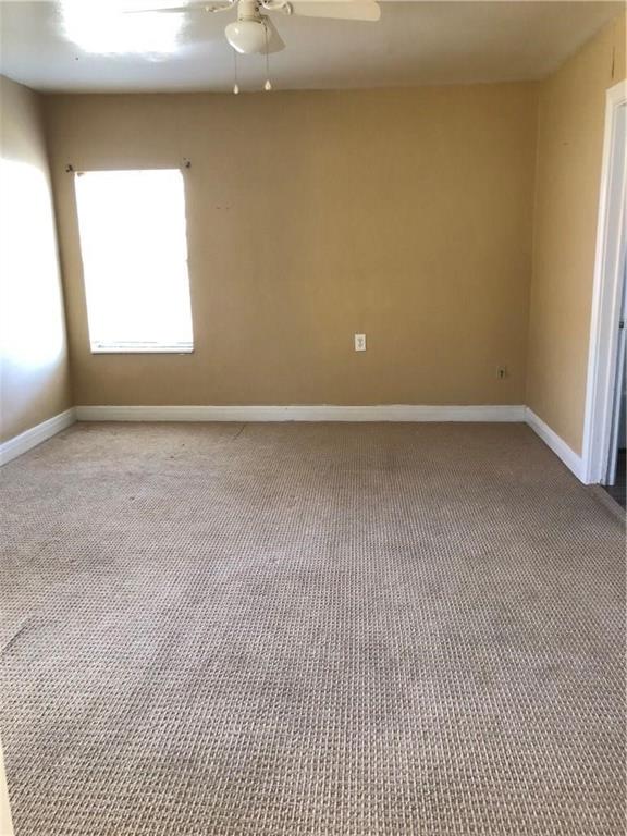 1602 South 9th Street Abilene, TX 79602 - Photo 6 of 9 an empty room with a window