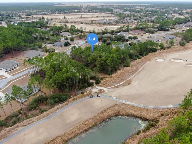 an aerial view of a house with a lake view