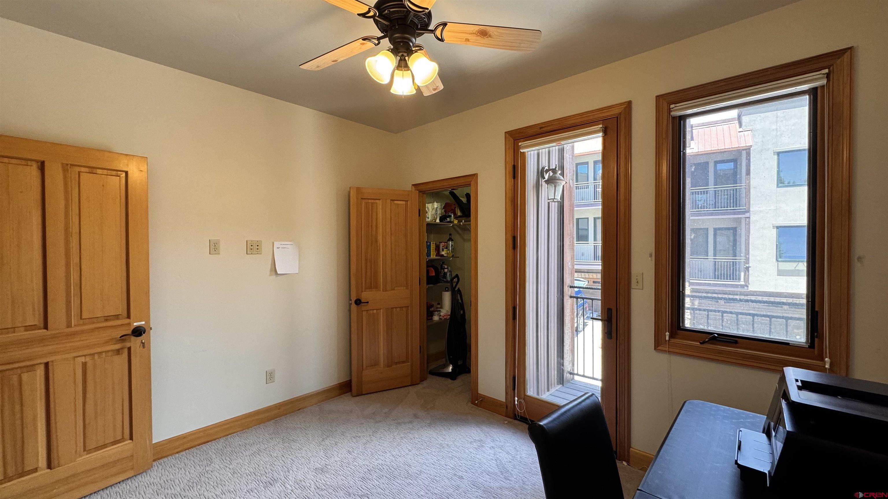 1422 Animas View Drive, Unit 55 Durango, CO 81301 - Photo 35 of 45 an empty room with windows and closet
