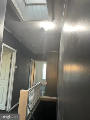 a room with a sink and a mirror