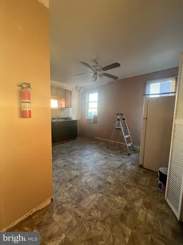 a view of an empty room with windows