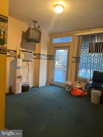a white toilet sitting next to a bathroom sink and vanity