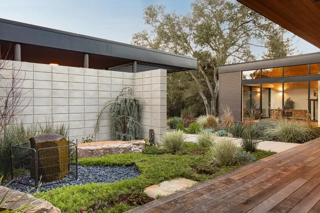 a backyard of a house with lots of green space
