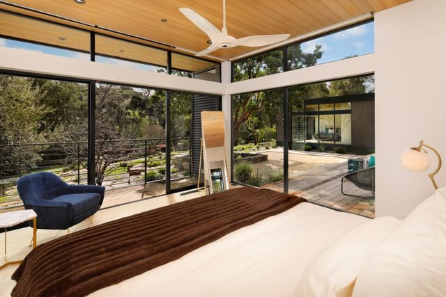 a building outdoor space with patio furniture and potted plants