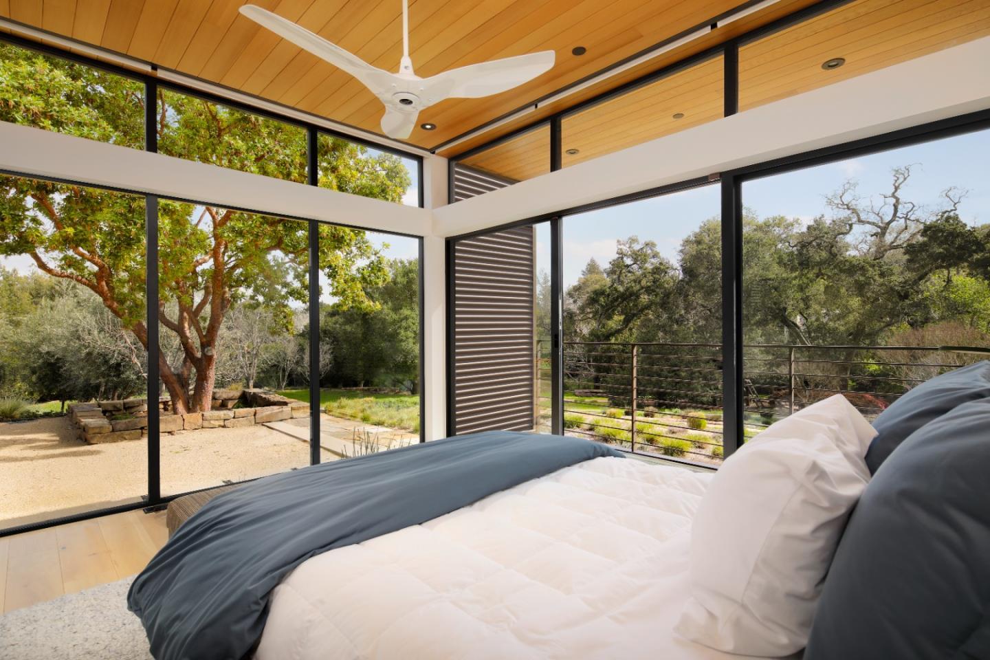 93 Broadacres Road Atherton, CA 94027 - Photo 9 of 18 a bedroom with a bed and a large window