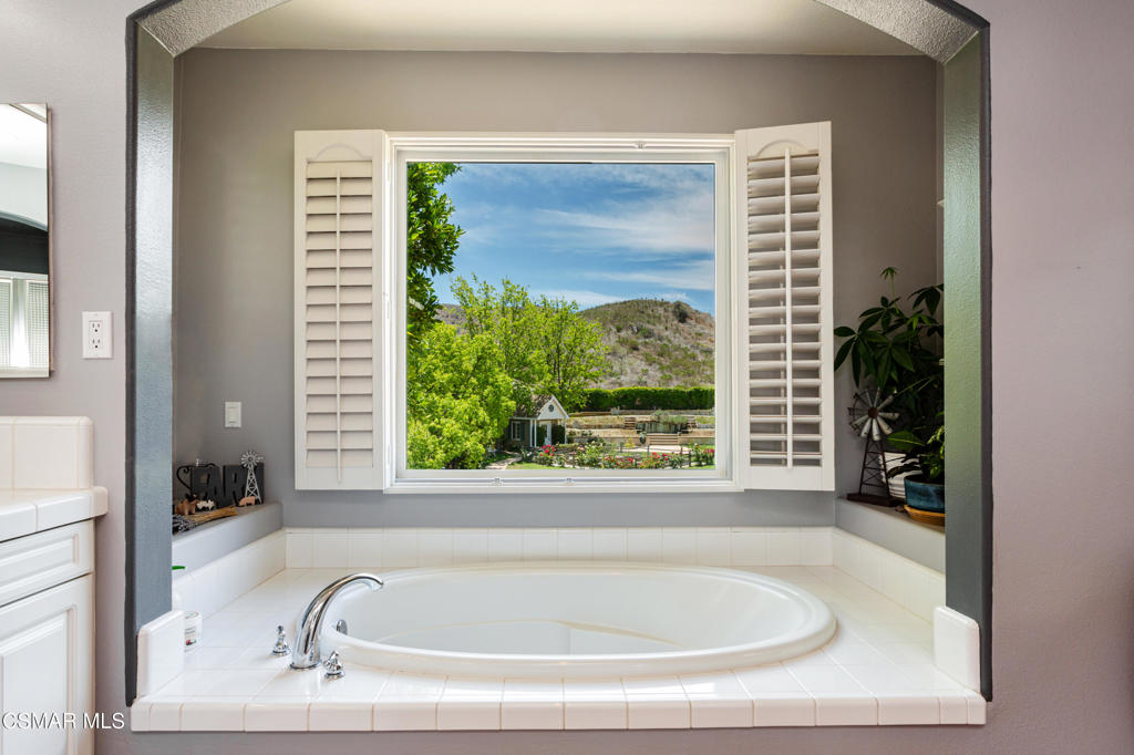 68 Twisted Oak Drive Simi Valley, CA 93065 - Photo 14 of 23 a bath tub sitting in a bathroom next to a window