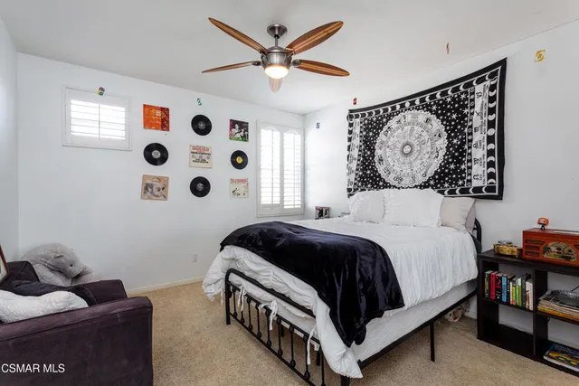 a bedroom with a bed and a wall in it