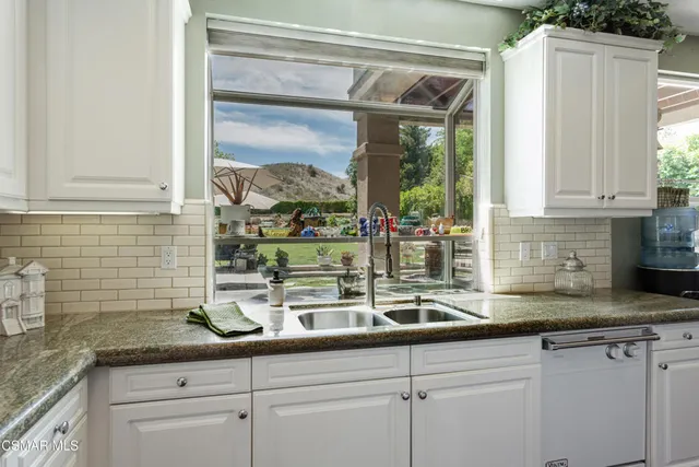a kitchen with a sink and a window