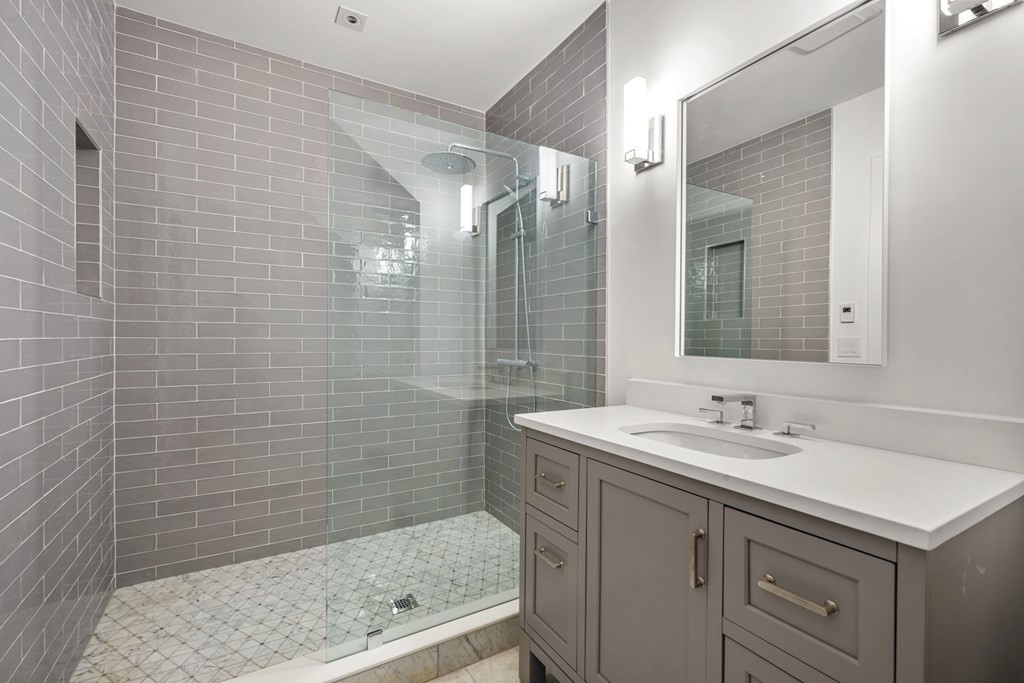 5 Radcliffe Road Weston, MA 02493 - Photo 41 of 41 a bathroom with a sink shower and a mirror