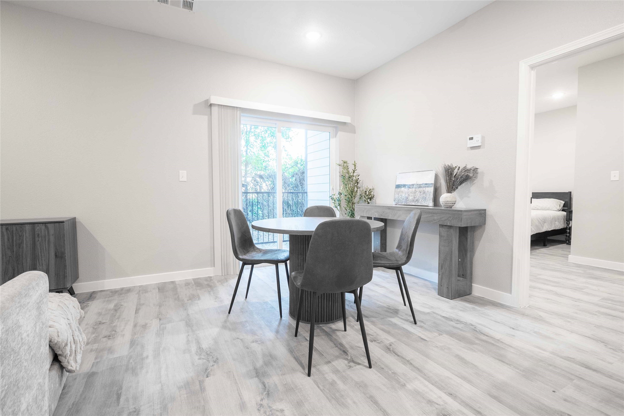 2101 Reinke Road, Unit 3310 Waller, TX 77484 - Photo 6 of 24 a view of a dining room with furniture and wooden floor