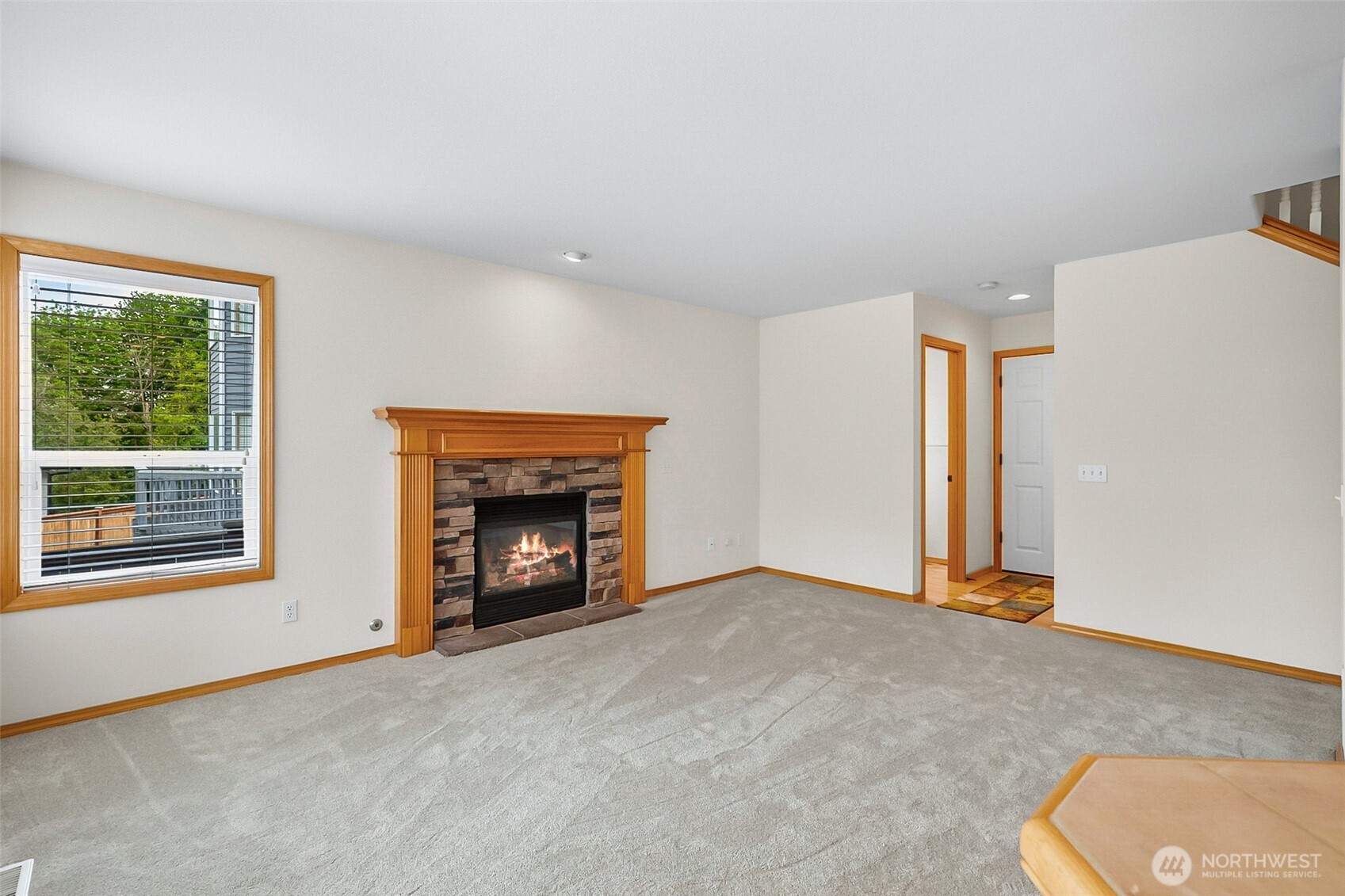 18410 11th Drive Southeast Bothell, WA 98012 - Photo 13 of 40 an empty room with a fireplace and window