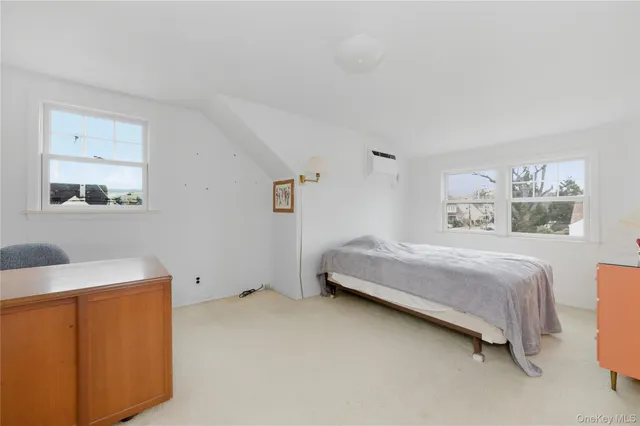 a bedroom with a bed and a cabinets