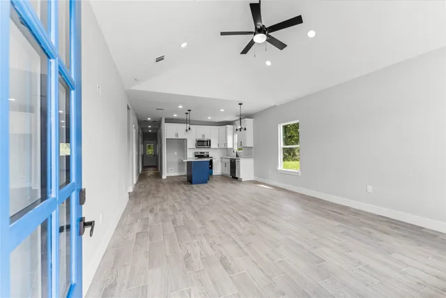 a view of a livingroom with furniture and a window