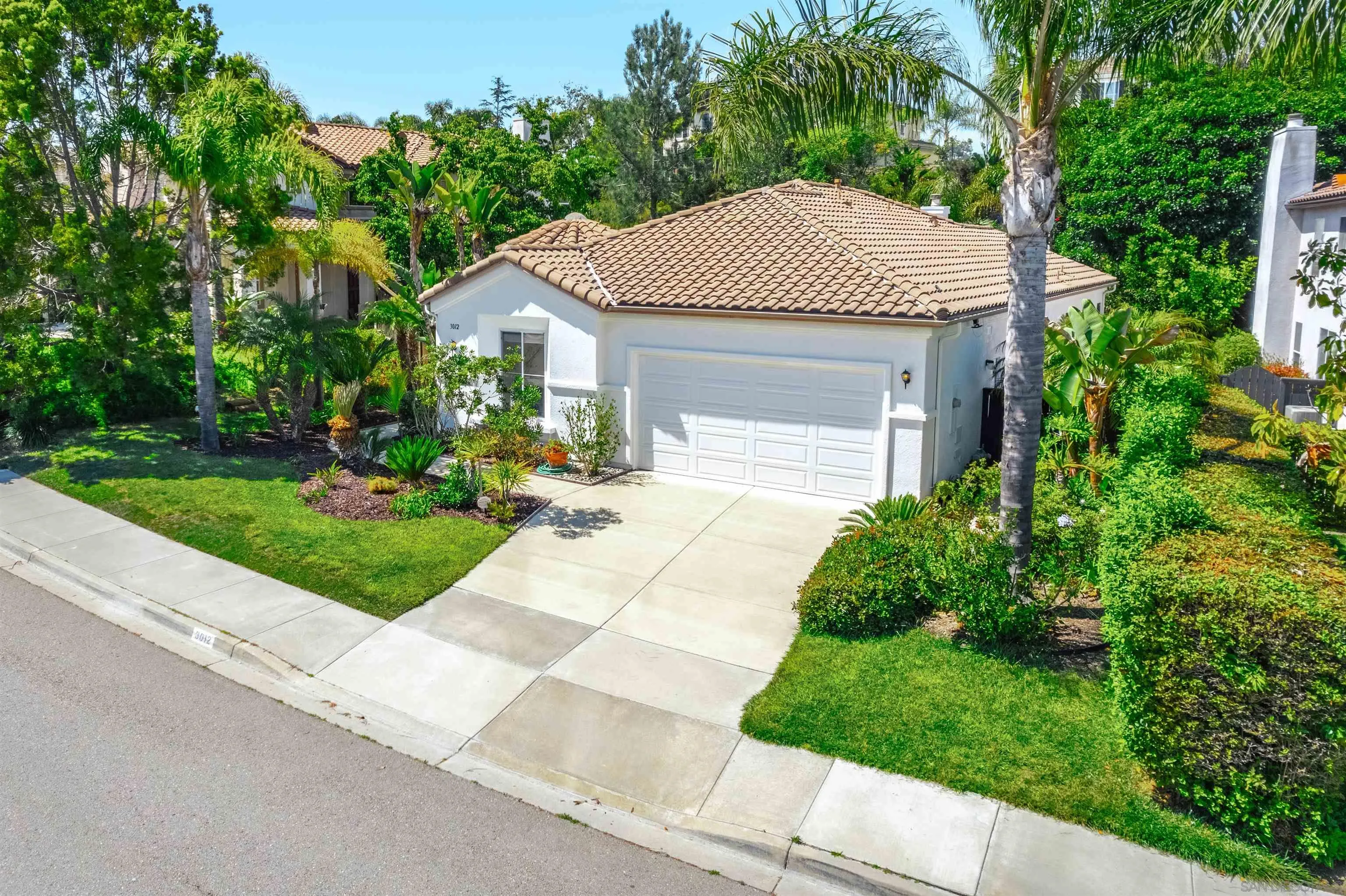 3012 Avenida Ciruela Carlsbad, CA 92009 - Photo 1 of 40 a front view of a house with a yard