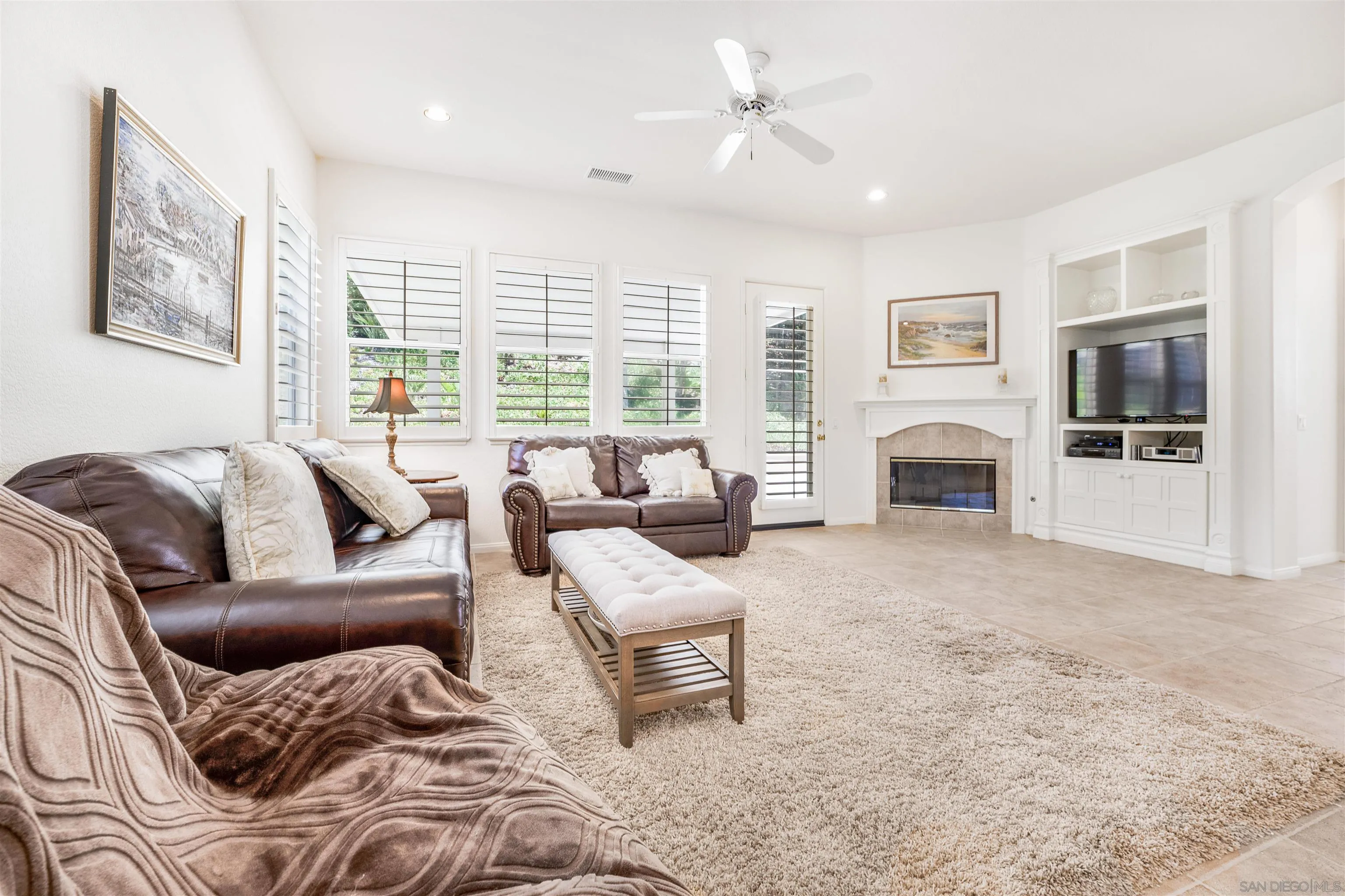 3012 Avenida Ciruela Carlsbad, CA 92009 - Photo 12 of 40 a living room with furniture and a fireplace