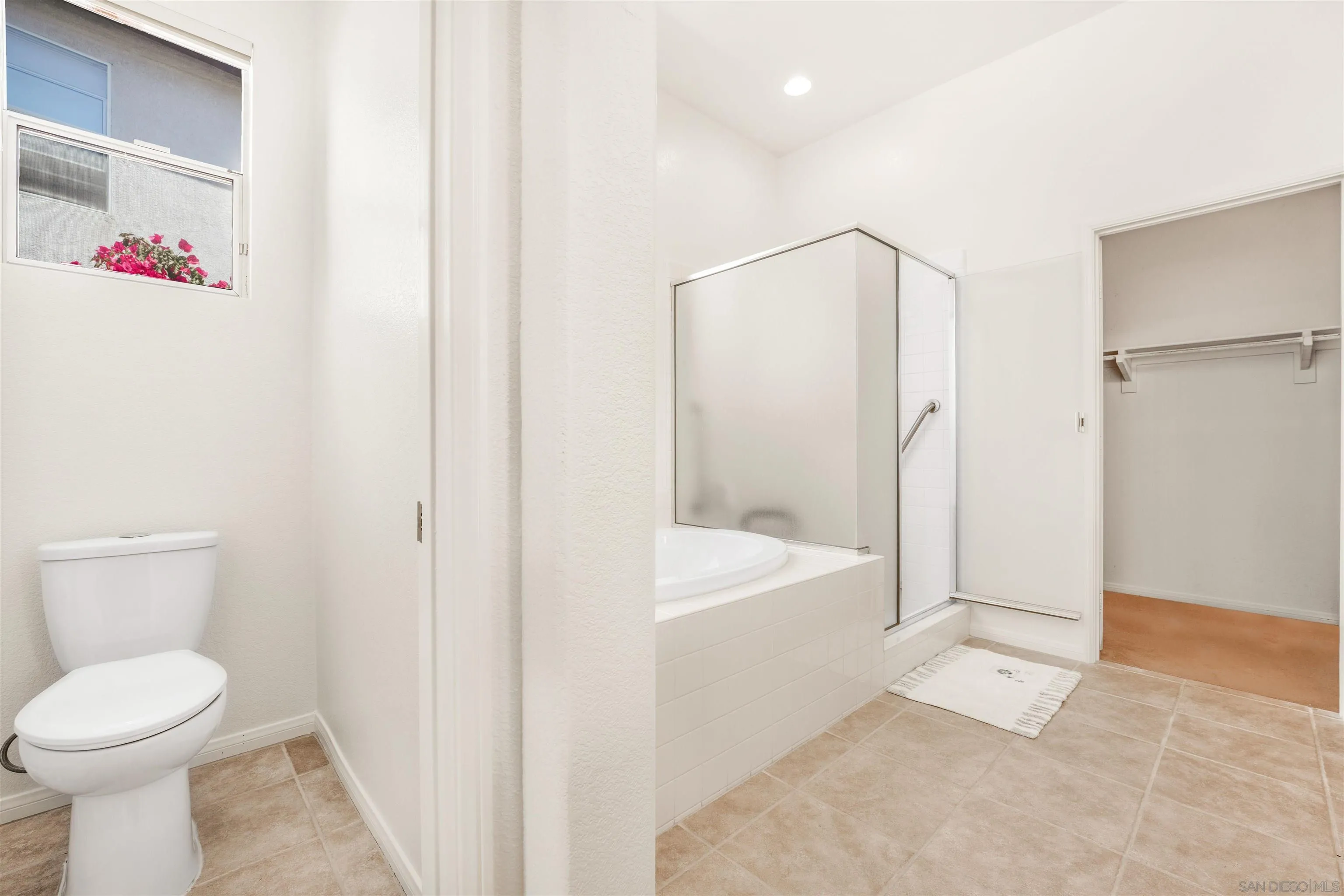 3012 Avenida Ciruela Carlsbad, CA 92009 - Photo 16 of 40 a bathroom with a shower and a toilet