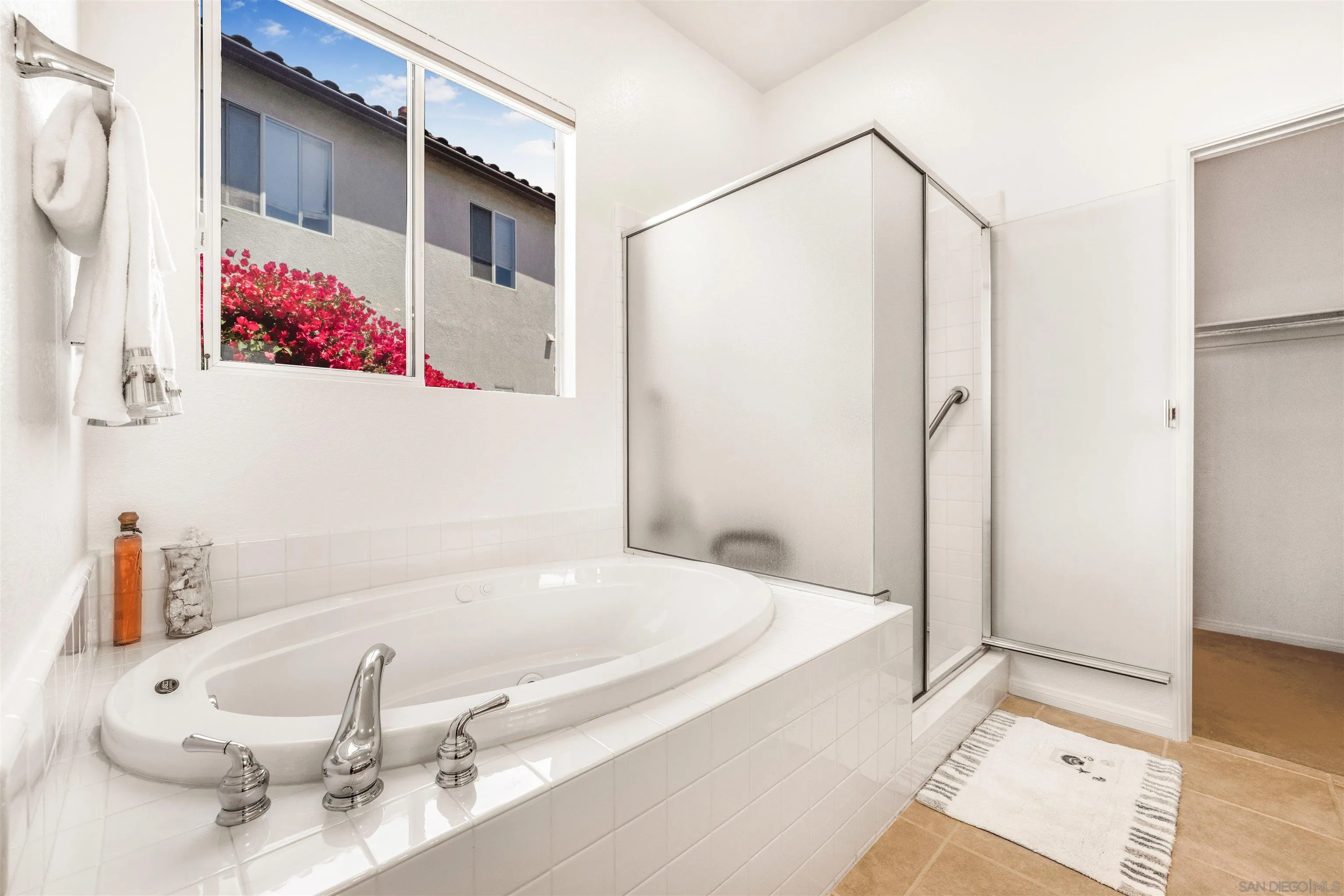 3012 Avenida Ciruela Carlsbad, CA 92009 - Photo 17 of 40 a bathroom with a tub and shower