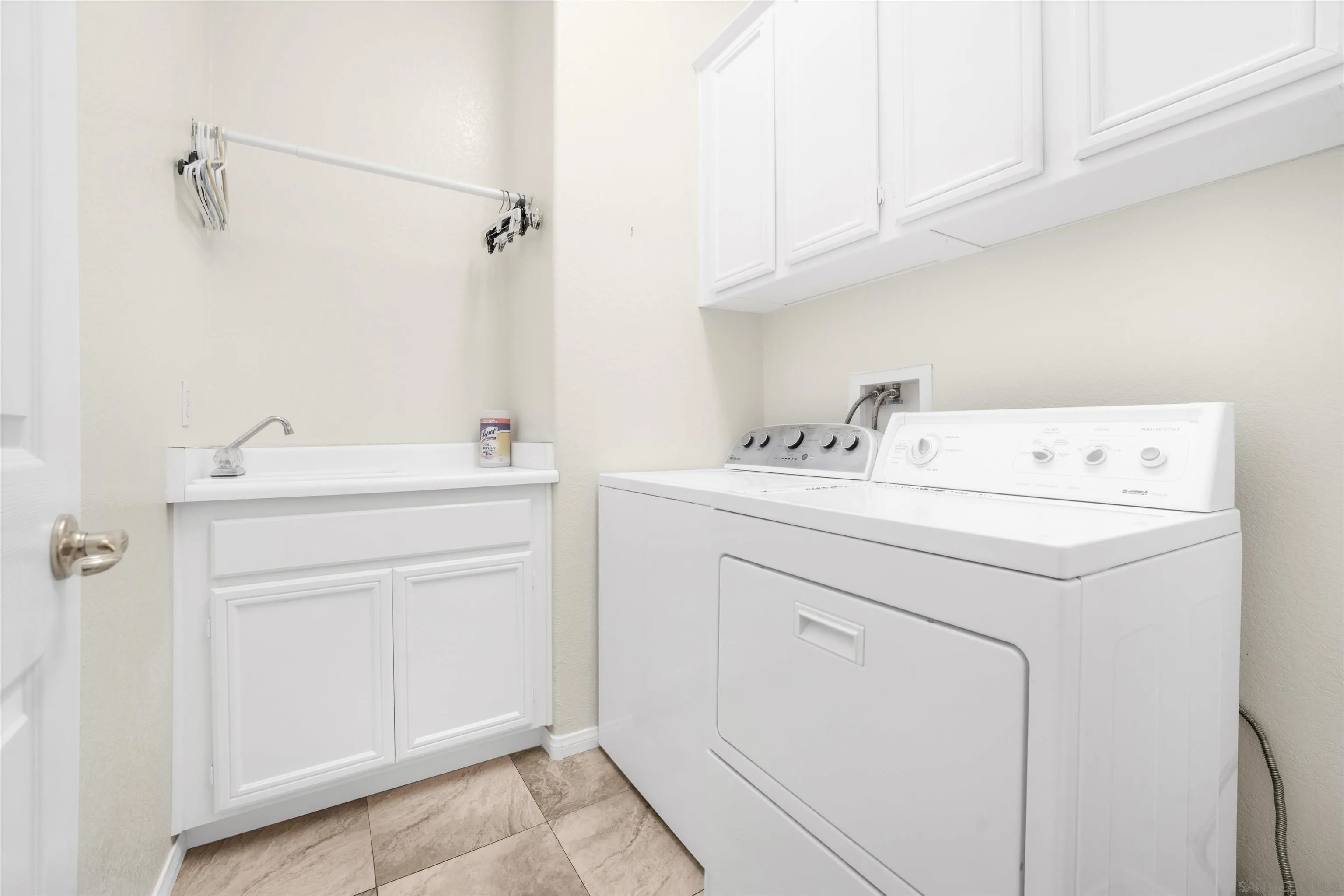 3012 Avenida Ciruela Carlsbad, CA 92009 - Photo 23 of 40 a utility room with a sink washer and dryer