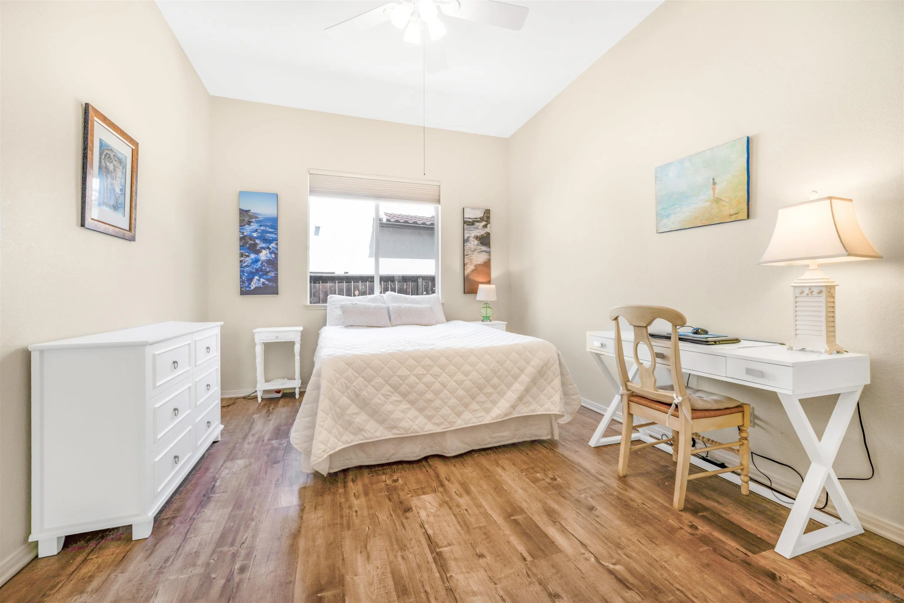 3012 Avenida Ciruela Carlsbad, CA 92009 - Photo 25 of 40 a spacious bedroom with a bed and a table in it
