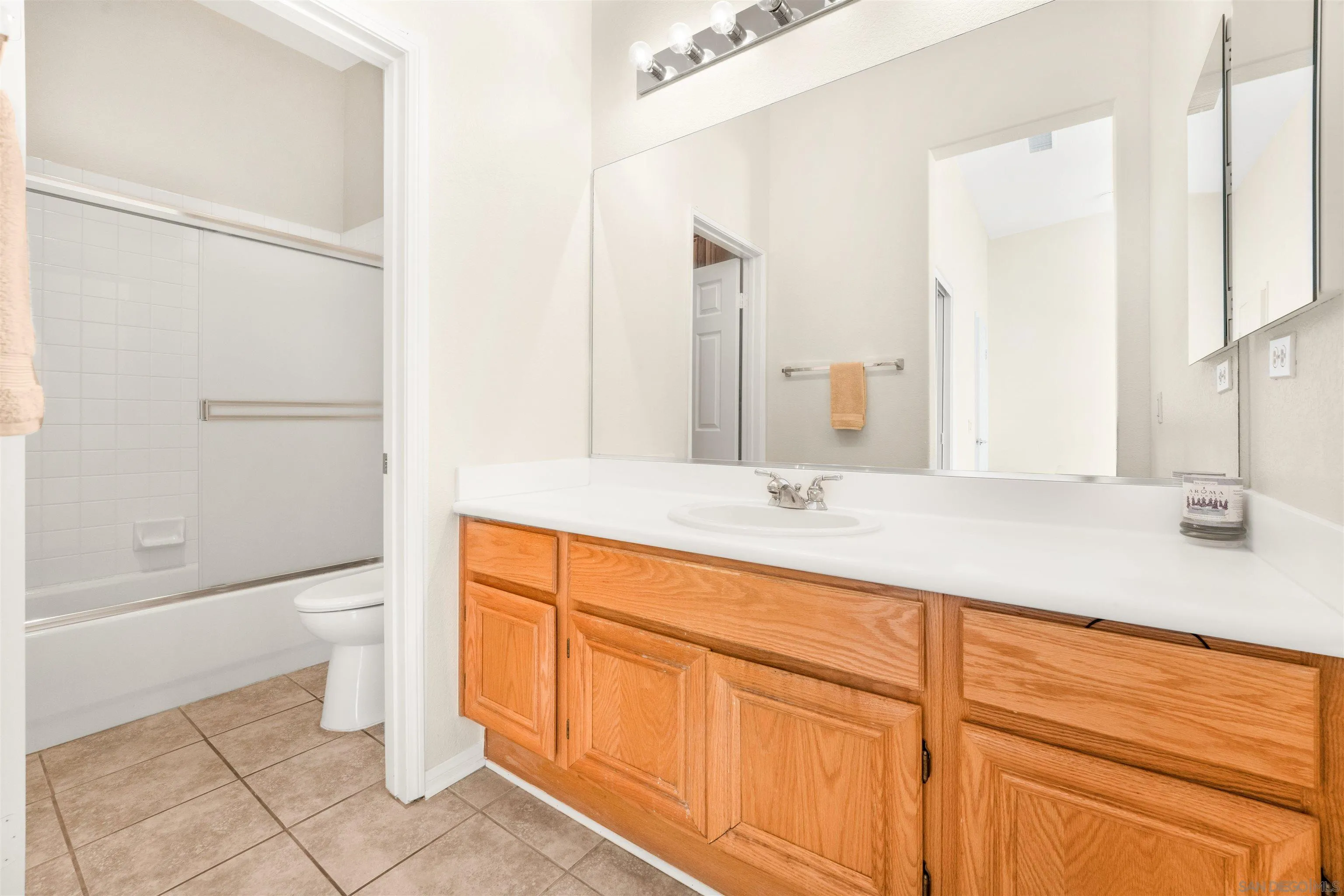 3012 Avenida Ciruela Carlsbad, CA 92009 - Photo 26 of 40 a bathroom with a granite countertop sink toilet and shower