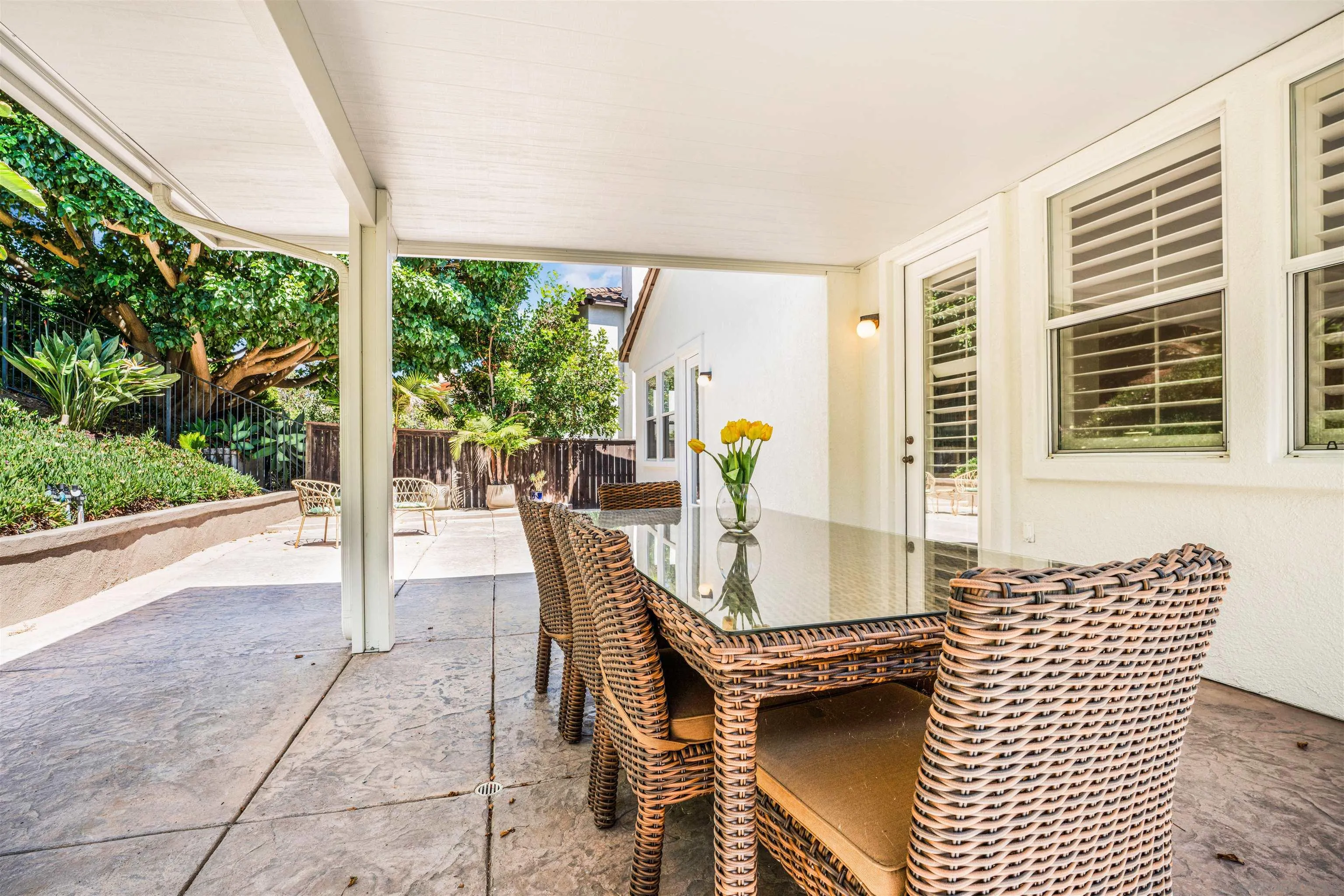 3012 Avenida Ciruela Carlsbad, CA 92009 - Photo 34 of 40 a dining room with furniture and a floor to ceiling window