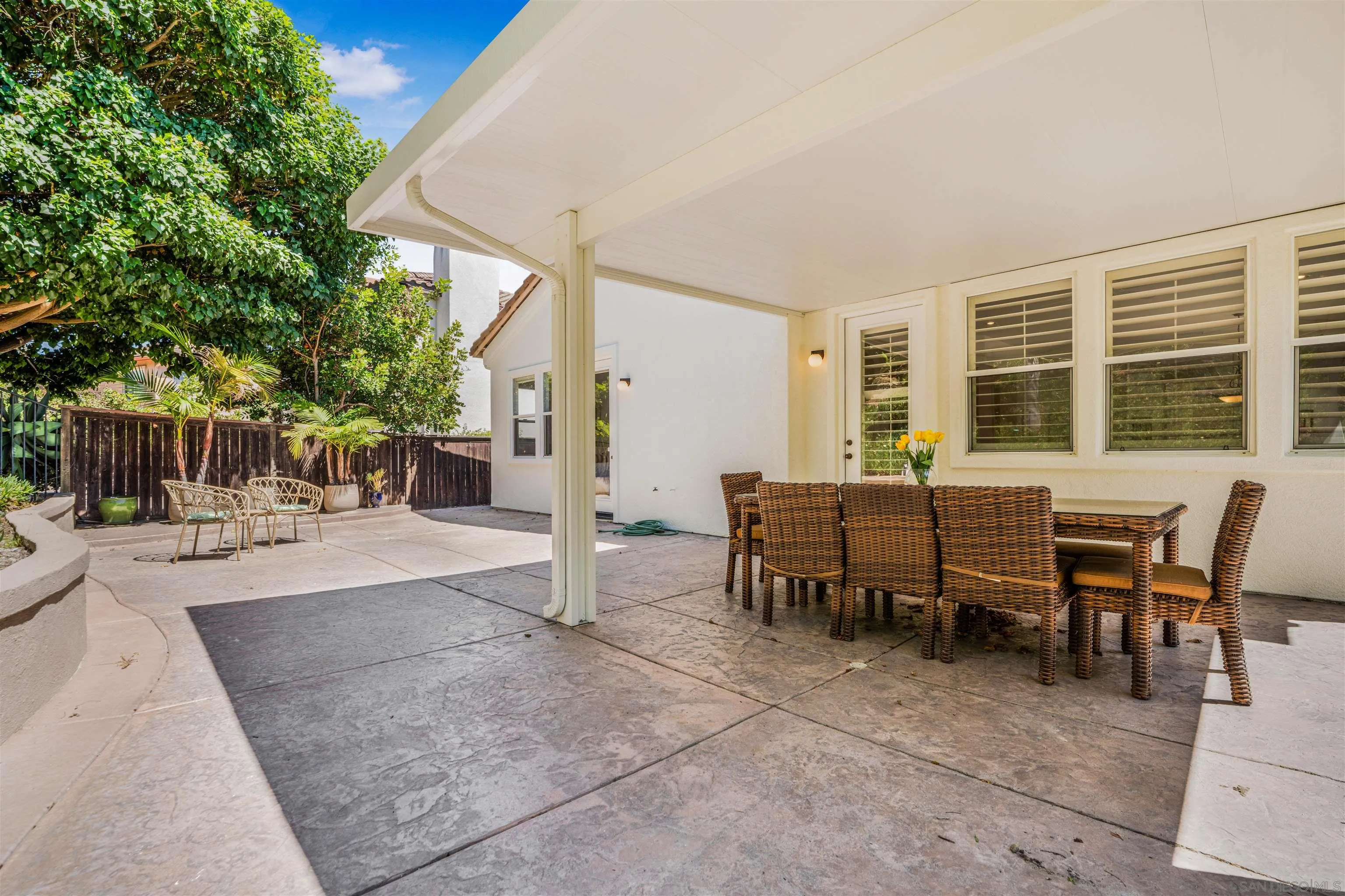 3012 Avenida Ciruela Carlsbad, CA 92009 - Photo 35 of 40 a view of a dining table and chairs in the patio