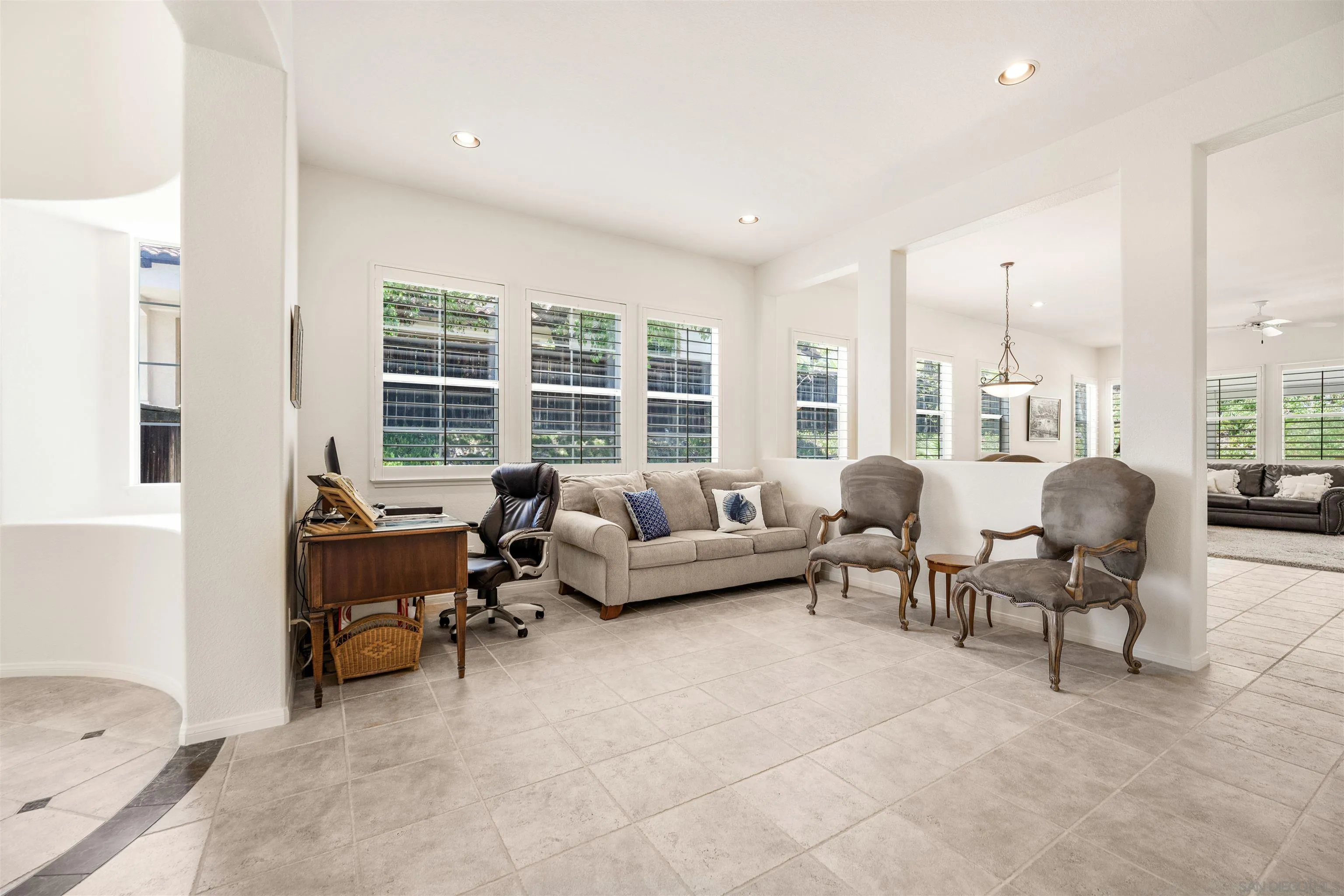 3012 Avenida Ciruela Carlsbad, CA 92009 - Photo 6 of 40 a living room with furniture and a floor to ceiling window