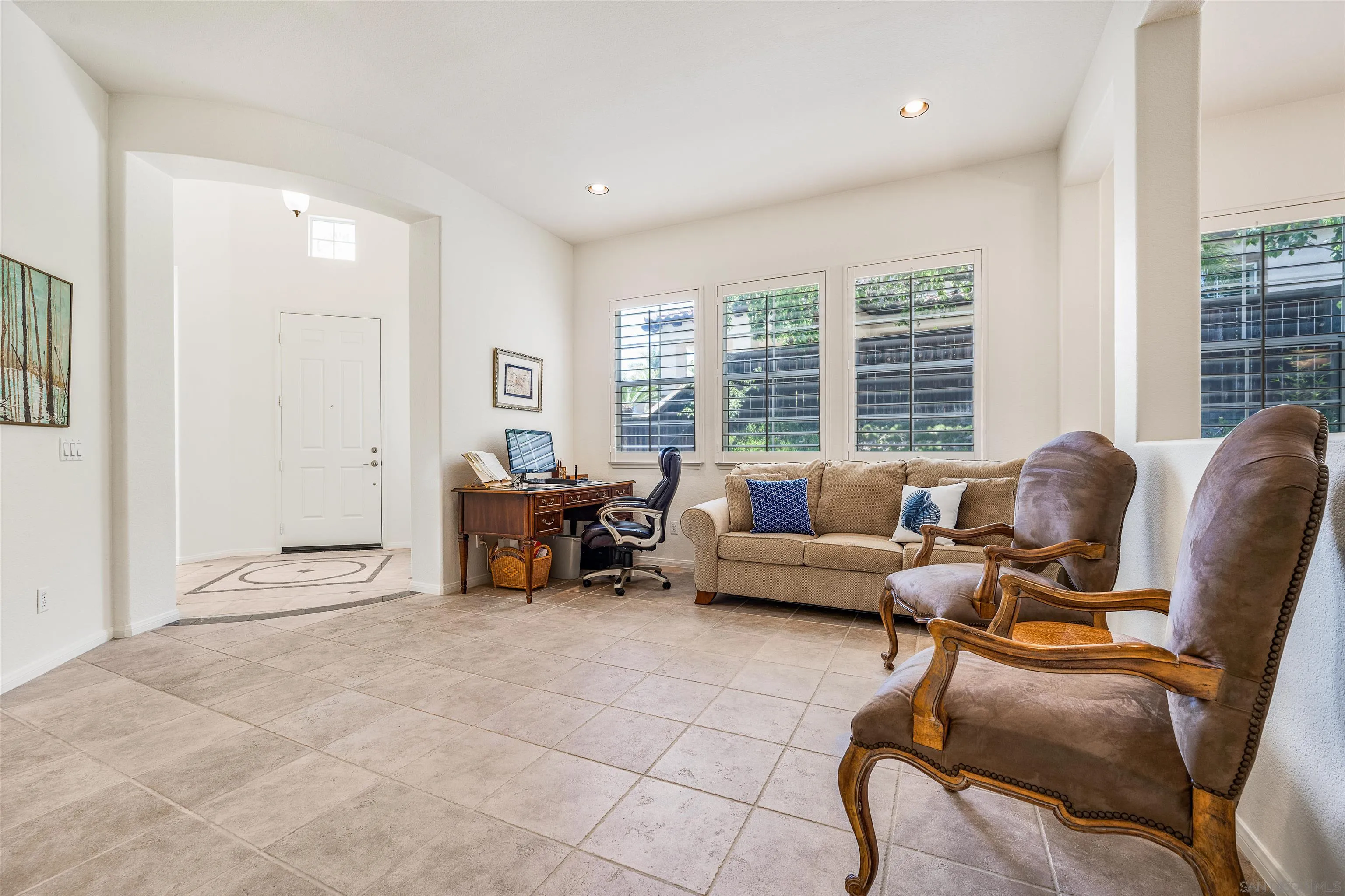 3012 Avenida Ciruela Carlsbad, CA 92009 - Photo 7 of 40 a living room with furniture and a large window