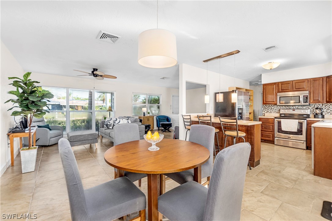 1448 Byron Road Fort Myers, FL 33919 - Photo 11 of 30 a view of a dining room with furniture