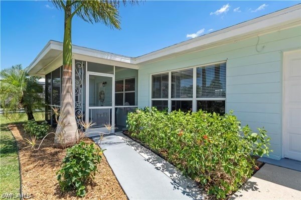 1448 Byron Road Fort Myers, FL 33919 - Photo 2 of 30 a front view of a house with a garden