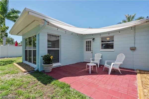 1448 Byron Road Fort Myers, FL 33919 - Photo 27 of 30 a patio with a table and chairs