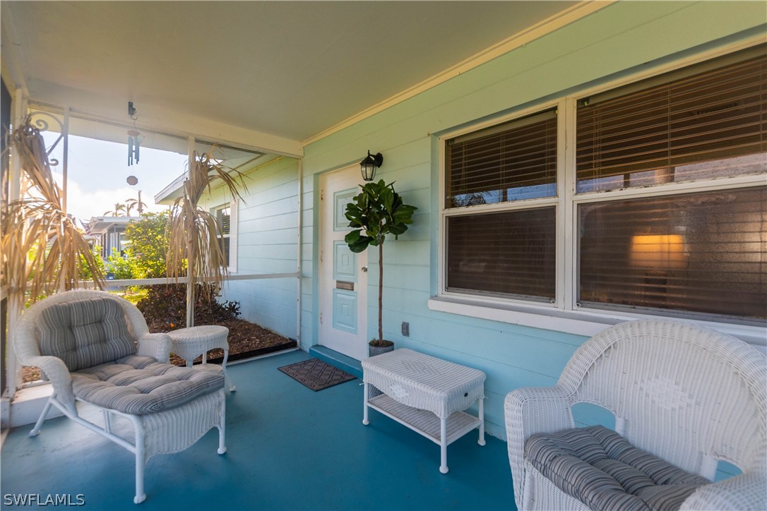 1448 Byron Road Fort Myers, FL 33919 - Photo 3 of 30 a living room with furniture and a flat screen tv