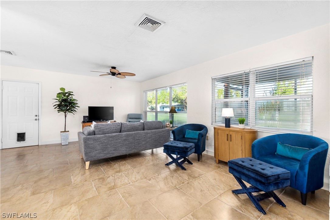 1448 Byron Road Fort Myers, FL 33919 - Photo 6 of 30 a living room with furniture and a large window