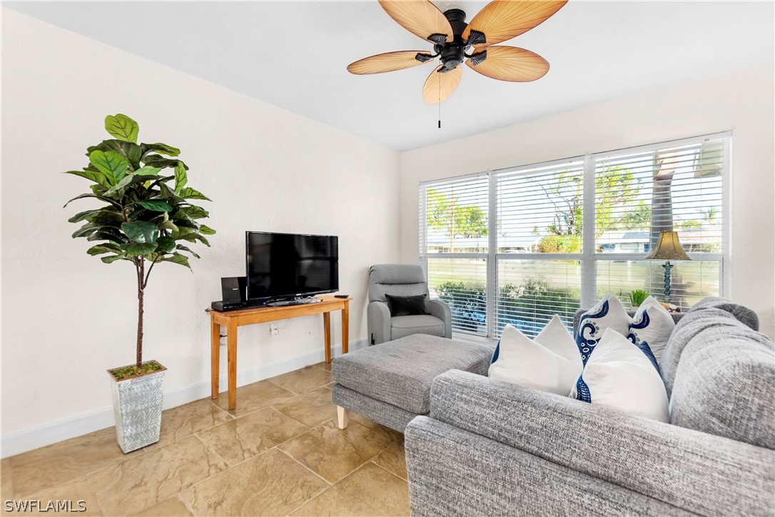 1448 Byron Road Fort Myers, FL 33919 - Photo 8 of 30 a living room with furniture and a flat screen tv