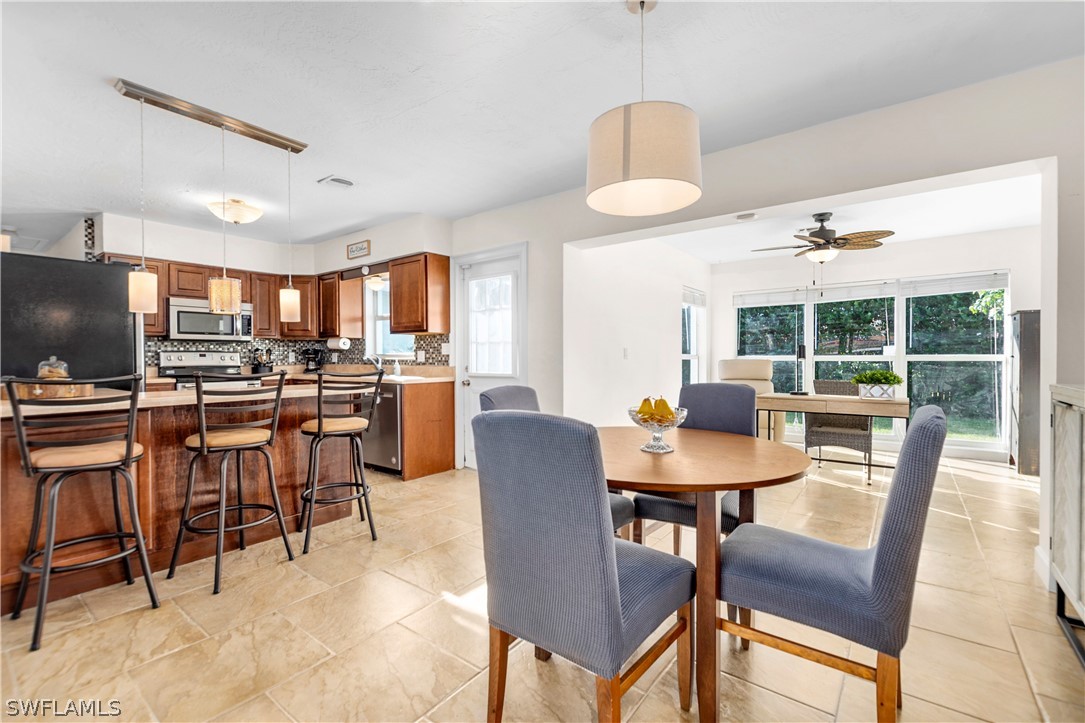 1448 Byron Road Fort Myers, FL 33919 - Photo 10 of 30 a view of a dining room with furniture window and outside view
