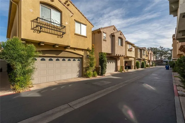 a view of a street with a building in the background