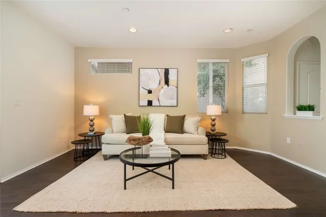 a living room with furniture rug and window