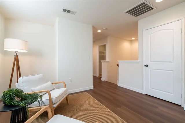 a view of a livingroom with furniture and wooden floor