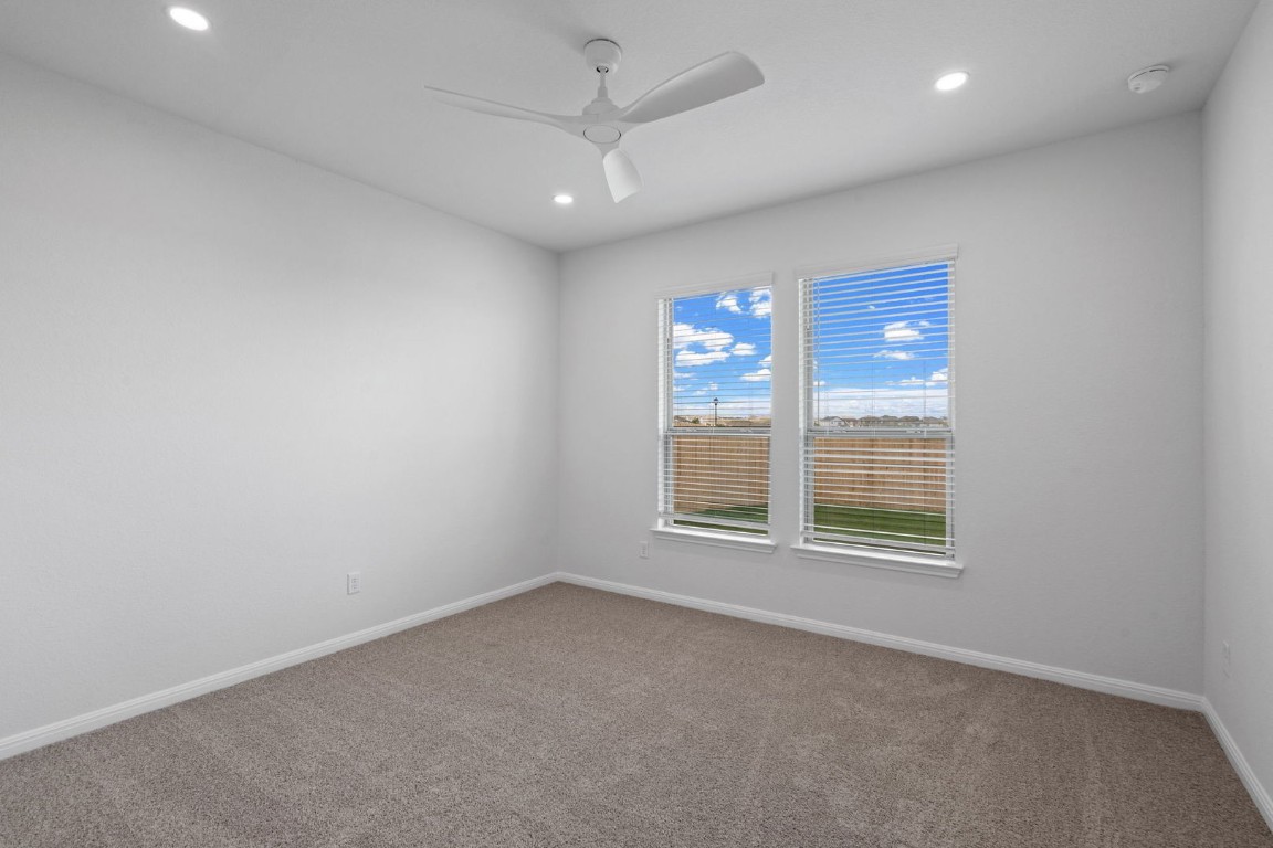 145 Hatari Trail Jarrell, TX 76537 - Photo 11 of 37 an empty room with a window