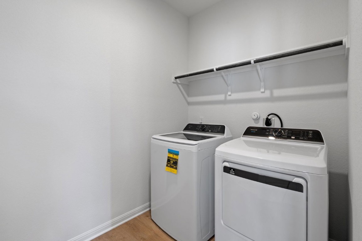 145 Hatari Trail Jarrell, TX 76537 - Photo 16 of 37 a utility room with dryer and washer