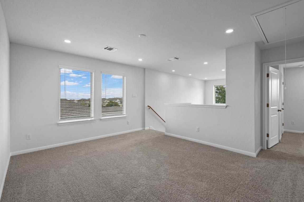145 Hatari Trail Jarrell, TX 76537 - Photo 18 of 37 a view of an empty room with a window