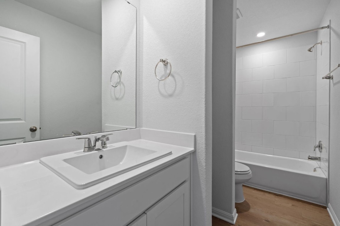 145 Hatari Trail Jarrell, TX 76537 - Photo 20 of 37 a bathroom with a sink a toilet and shower