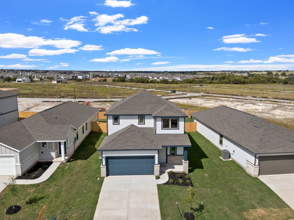 145 Hatari Trail Jarrell, TX 76537 - Photo 31 of 37 a aerial view of a house with a yard
