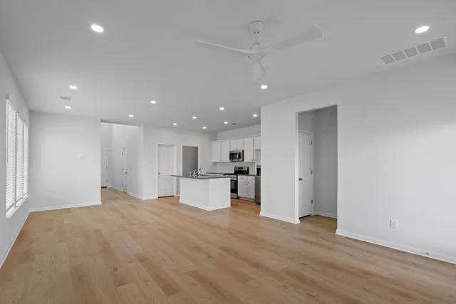a view of kitchen with wooden floor