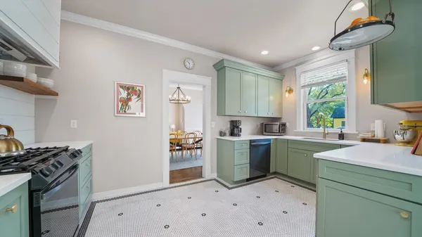 a bedroom with a bed and a lamp