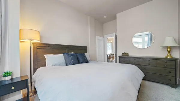 a bathroom with a sink a mirror and a toilet