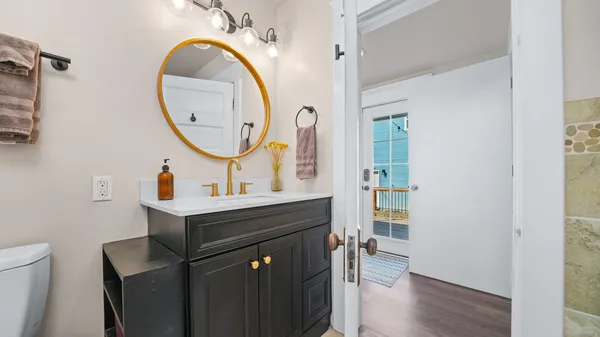 a bathroom with a glass shower door